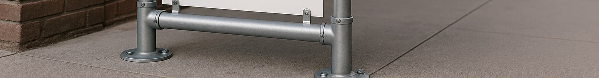 key clamping fitting system for signage